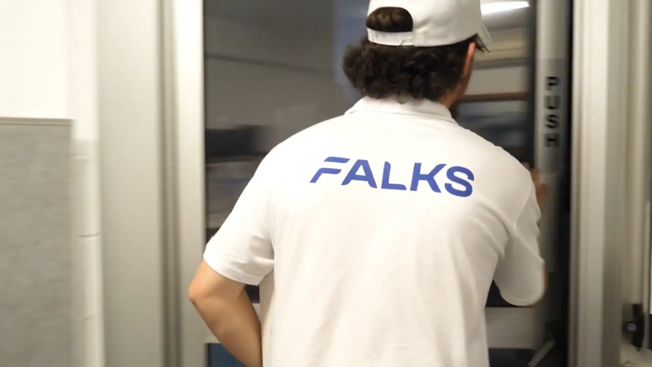 Technician installing a dual monitor workstation